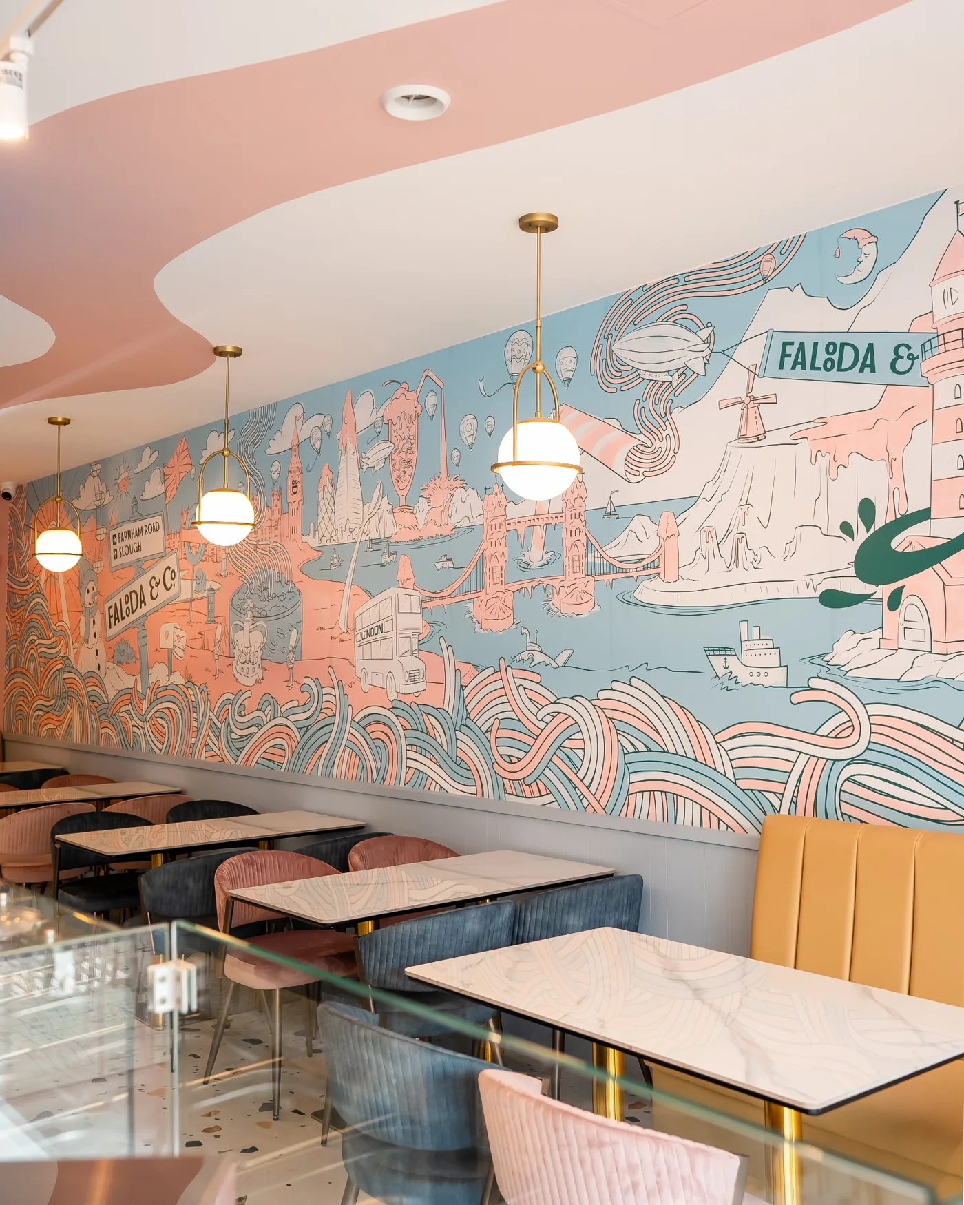 Falooda & Co interior detail showing mural, lighting and tables