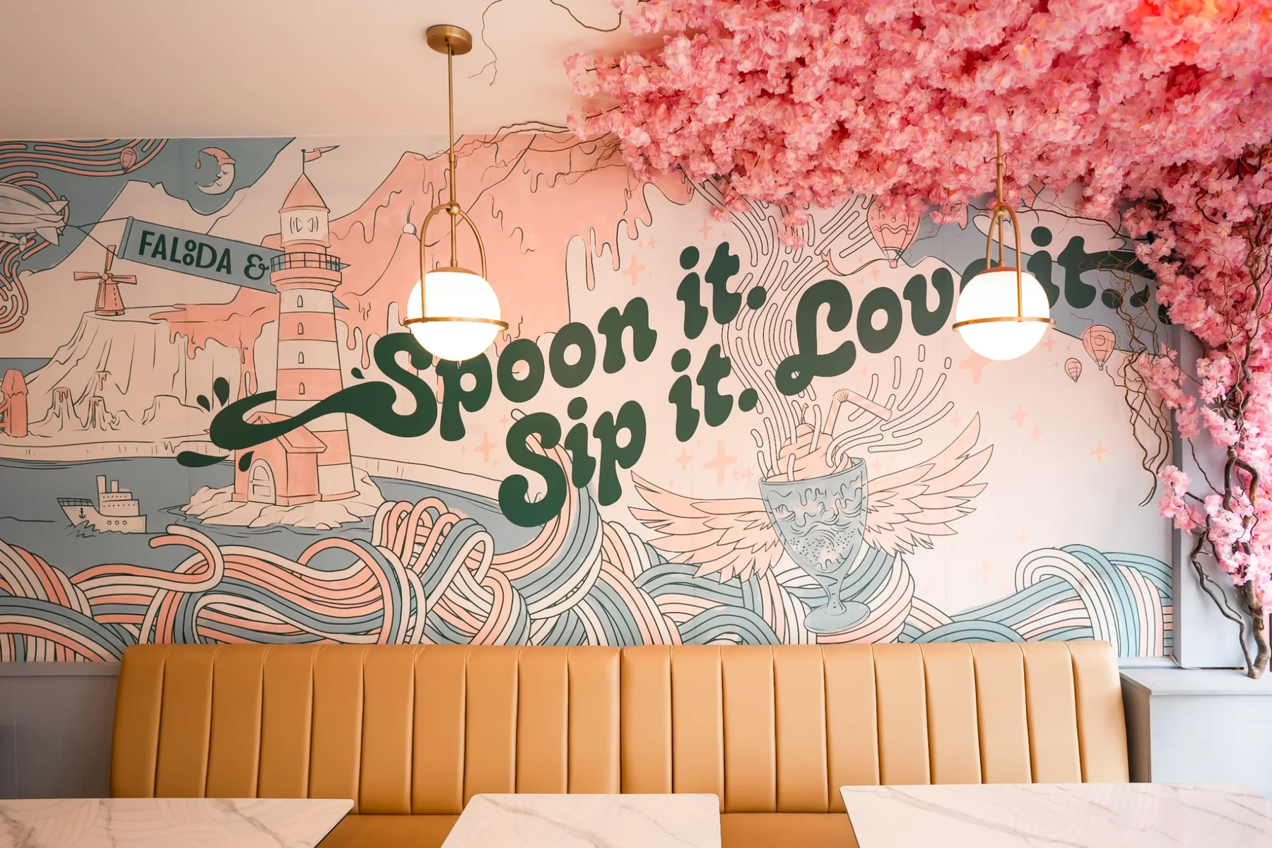 Completed Falooda & Co restaurant interior with illustrated mural and seating